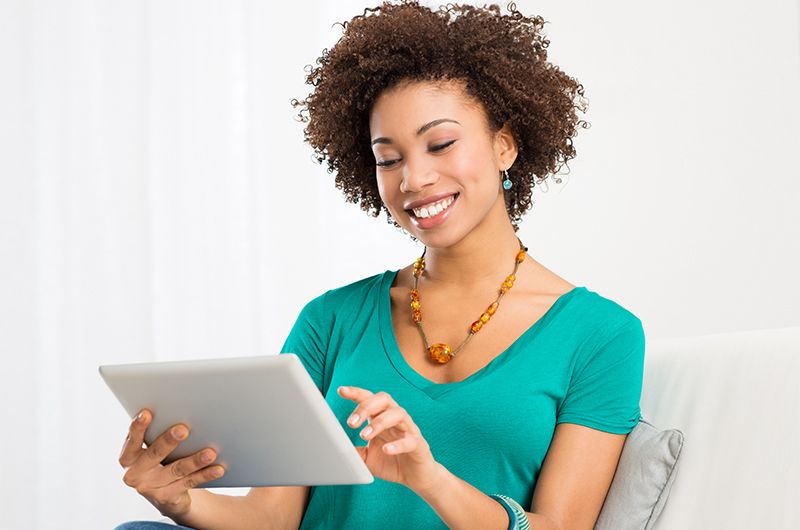 Woman on tablet ordering groceries for delivery