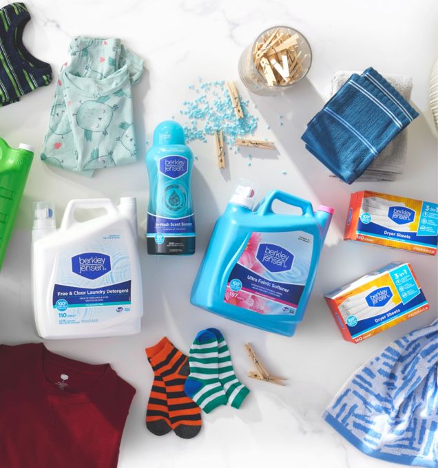 Flatlay photo of household essentials including laundry detergents and summer clothing