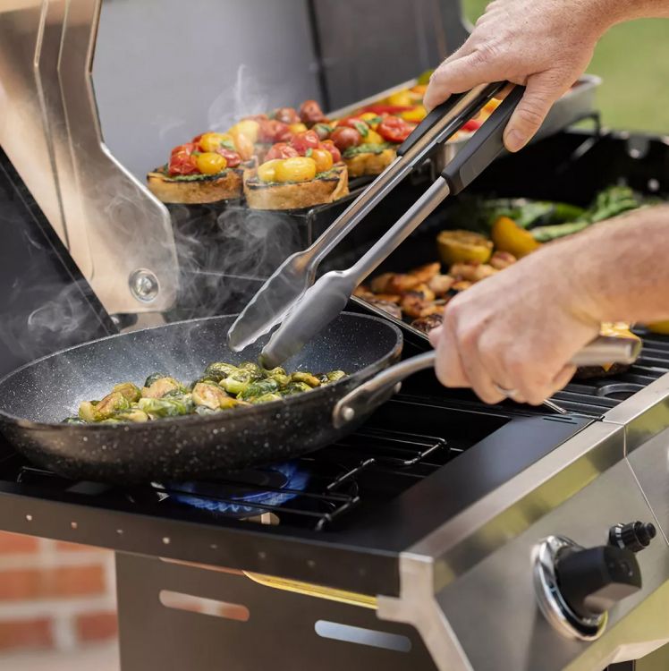 Outdoor grilling vegetables and chicken