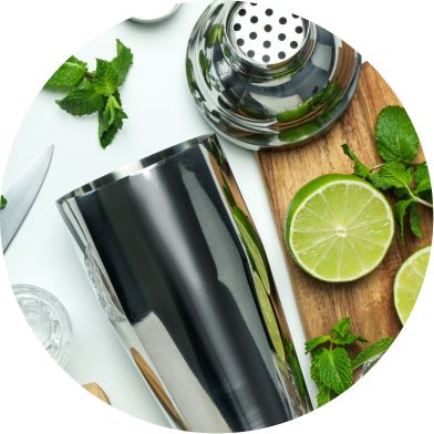 Mixology Essentials: Mixology tools and lime on a table.