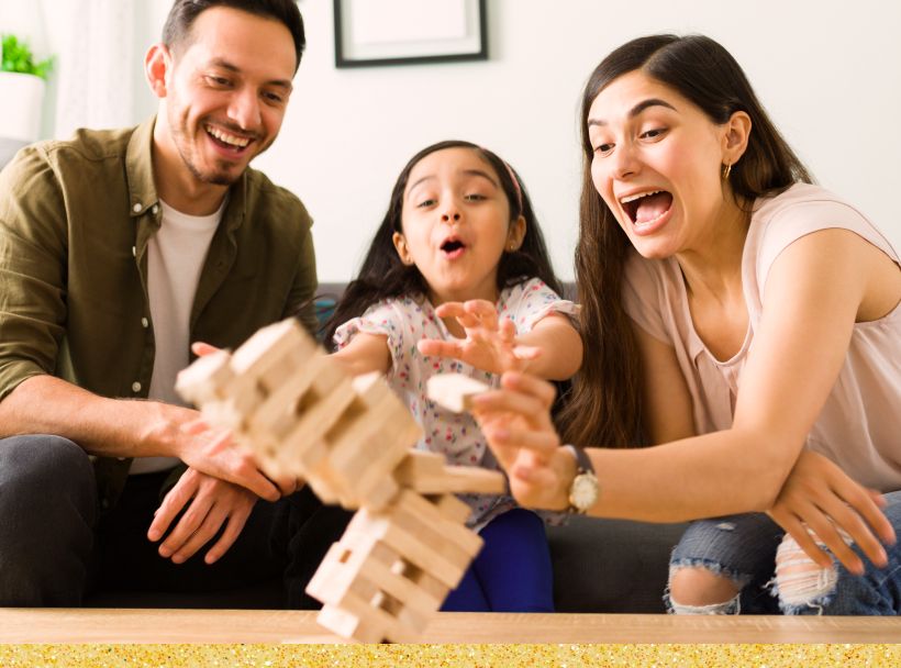 Image: Family having a great time playing board games.