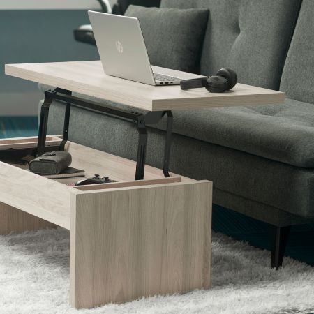 A light-colored wooden coffee table with raising table top