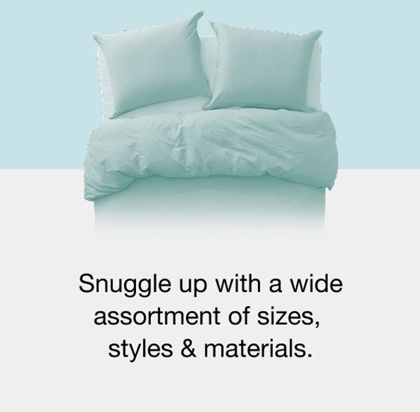 a pair of white comforters on a blue background