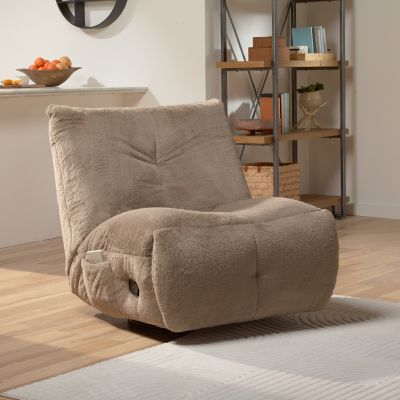 Image: Beige tufted chair on a light rug in a living room.