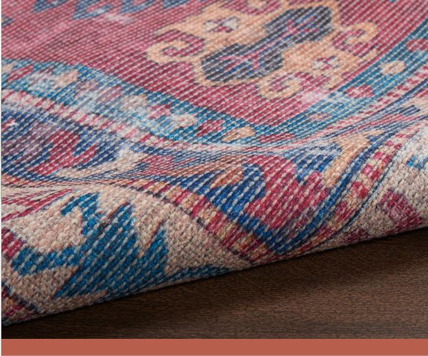 A close-up image of a red, blue and beige woven rug.