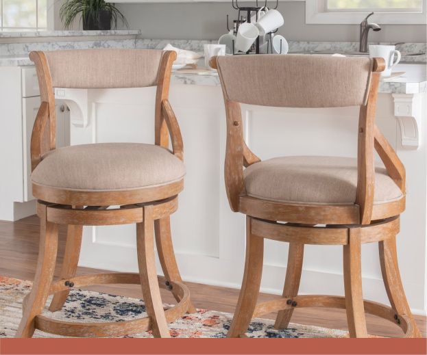 A set of kitchen stools with beige padding.