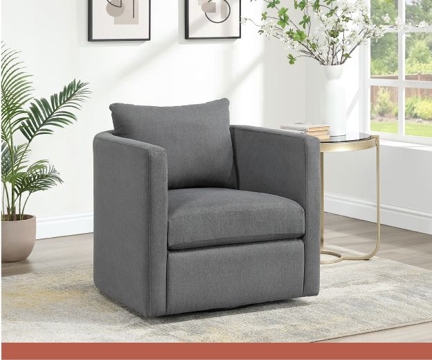 A heather gray recliner in front of a white wall