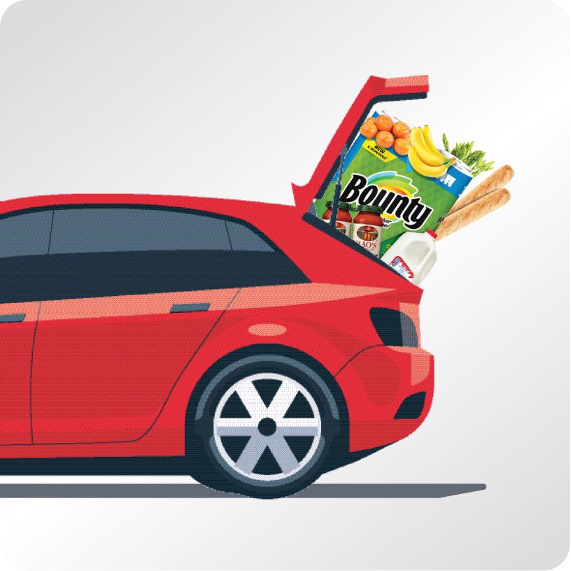 A red hatchback with a trunk full of groceries