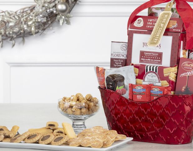A gift basket of chocolate, cookies, crackers and caramel corn