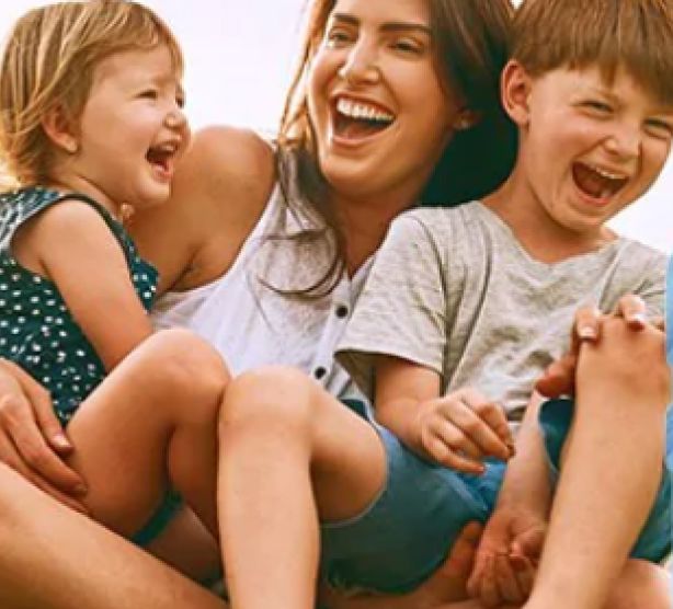 Healthy mother and children together having a good time