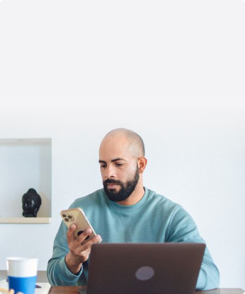 A current AT&T customer sitting at his table, looking at options for his next smartphone upgrade